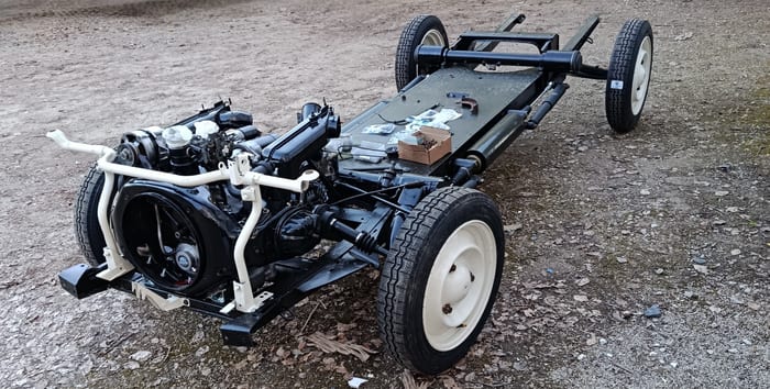 Restored chassis of our Citroën 2CV4 with engine back in place and new tyres fitted